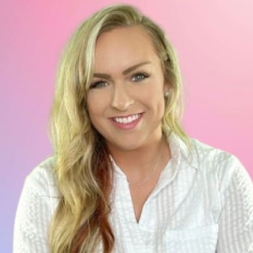 a woman in a white shirt is smiling in front of a pink and purple background .