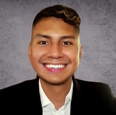 a man in a suit and white shirt is smiling for the camera